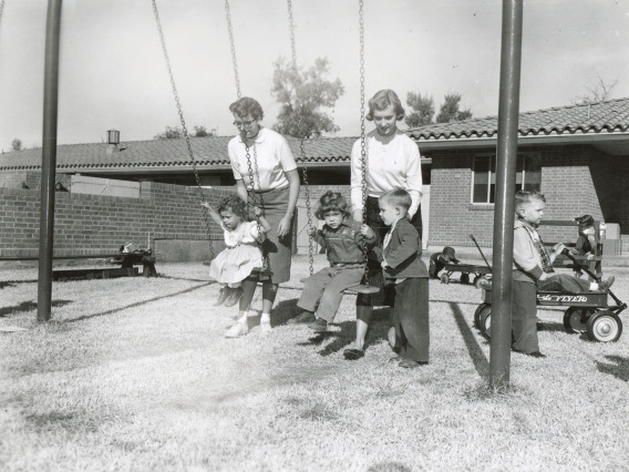 children on a swing (UArizona Archives)